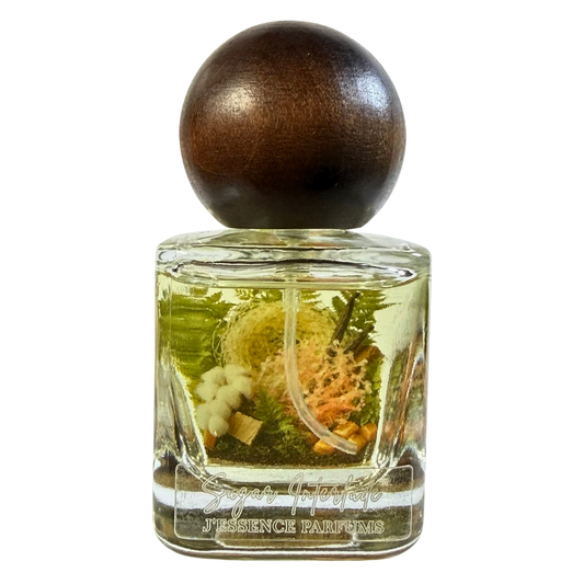 Artisanal 30ml Sugar Interlude perfume bottle with a spherical wooden cap and a botanical terrarium style label. J'essence Parfums niche gourmand fragrance hand poured in NZ.
