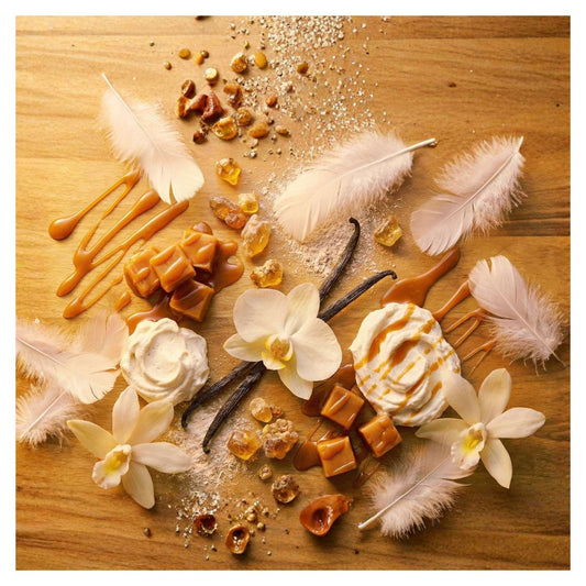 Ambre Caprice by J'essence Parfums flat lay featuring Creamy Caramel, Whipped Vanilla, Vanilla Orchid, Soft Powder, Vanilla Bean, Warm Amber, Skin Musk; extrait de parfum hand-blended and made in NZ.